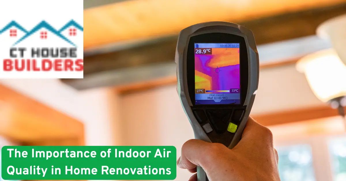 Hand holding thermal imaging device measuring indoor air quality during a home renovation to ensure healthy and safe living spaces