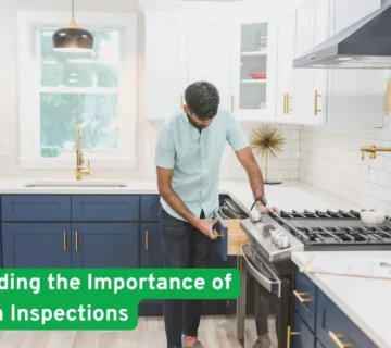 Home inspector checking kitchen foundation while homeowner observes, CT House Builders stressing importance of foundation inspections