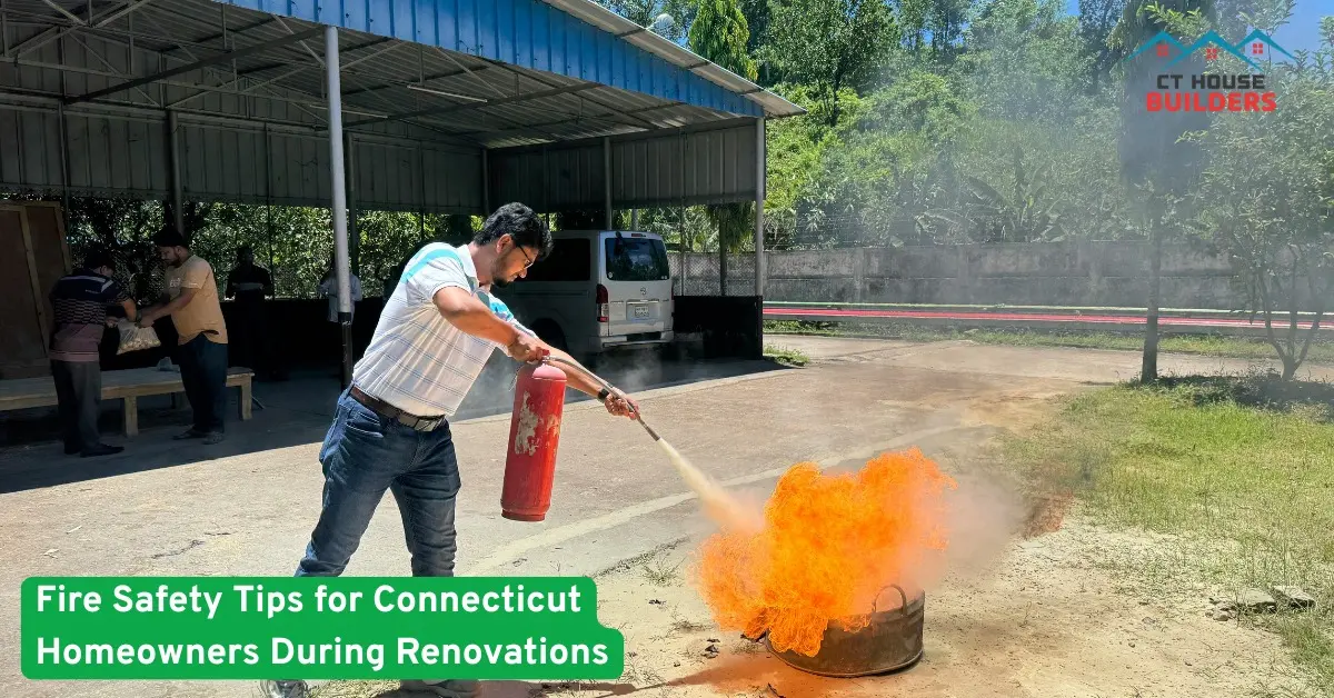Man using fire extinguisher on open flames during a renovation safety drill outside a Connecticut home construction site now.