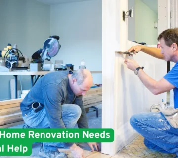 Two contractors working indoors during a home renovation, measuring walls and installing trim, showing need for professional