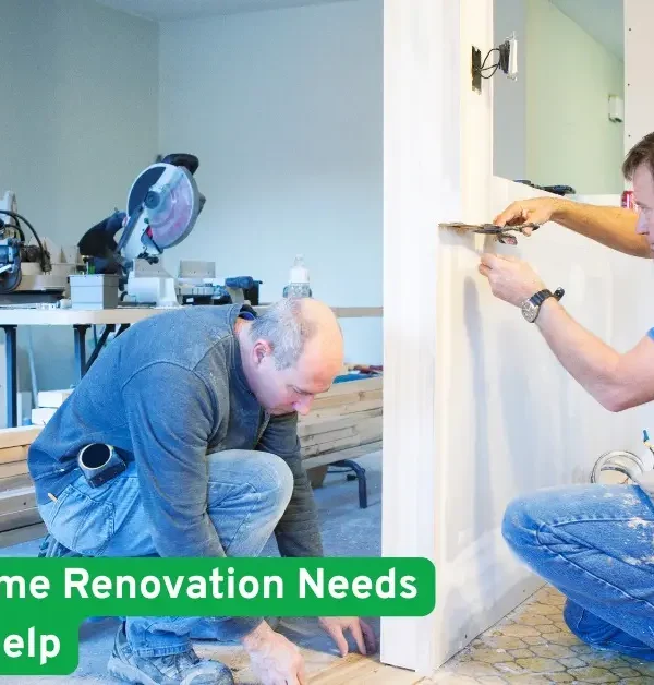 Two contractors working indoors during a home renovation, measuring walls and installing trim, showing need for professional